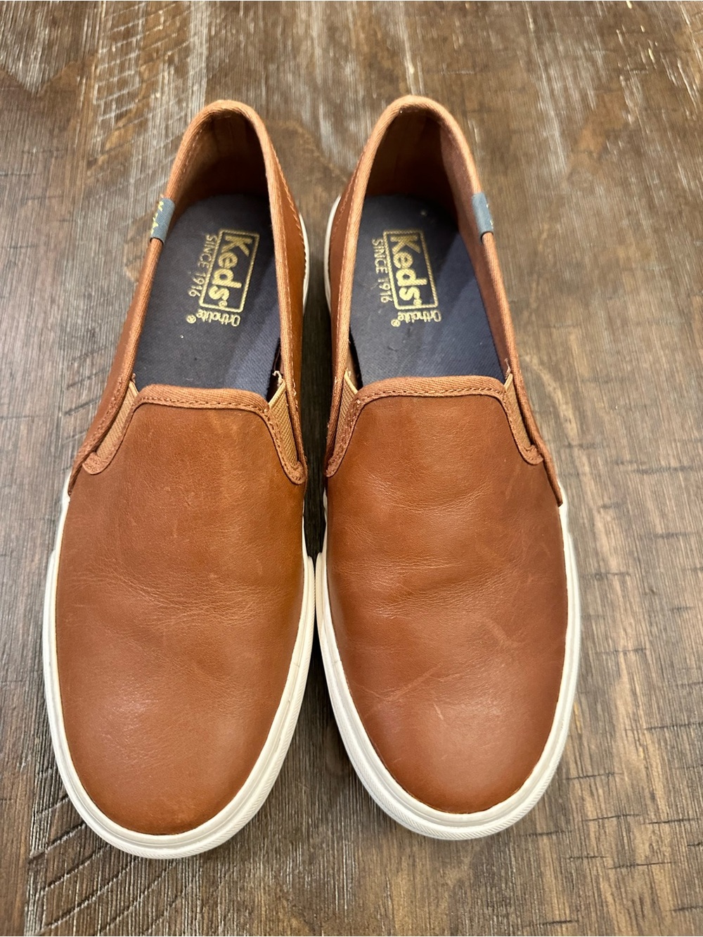 Keds Women's Double Decker Leather Slip-On sneakers in a cognac brown color